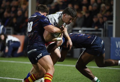 270226 - Edinburgh Rugby v Scarlets - United Rugby Championship - Max Douglas of Scarlets is tackled just short of the Edinburgh line by Ross Thompson of Edinburgh (10) and Malelili Satala of Edinburgh