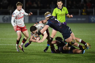 270226 - Edinburgh Rugby v Scarlets - United Rugby Championship - Fletcher Anderson of Scarlets caught by the flying tackle of Dylan Richardson of Edinburgh
