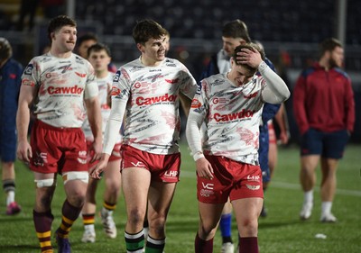 270226 - Edinburgh Rugby v Scarlets - United Rugby Championship - Scarlets players leave the field dejected following a 24-19 defeat