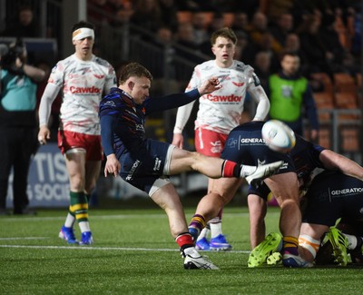 270226 - Edinburgh Rugby v Scarlets - United Rugby Championship - Ben Vellacott of Edinburgh puts in a clearance kick