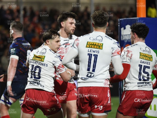 270226 - Edinburgh Rugby v Scarlets - United Rugby Championship - Joe Roberts of Scarlets celebrates his first half try