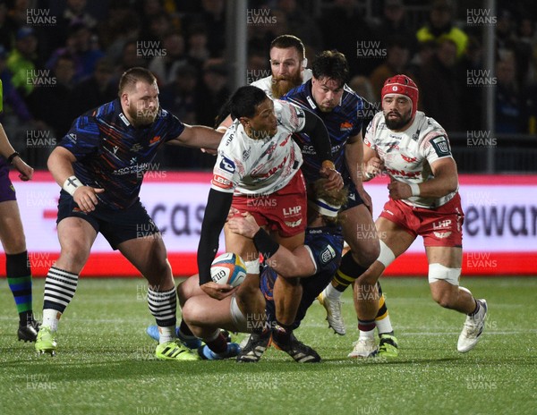 270226 - Edinburgh Rugby v Scarlets - United Rugby Championship - Sam Lousi of Scarlets looks to offload the ball as he is tackled