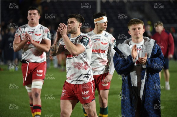 270226 - Edinburgh Rugby v Scarlets - United Rugby Championship - Joe Roberts of Scarlets (2nd left) leaves the field dejected following a 24-19 defeat