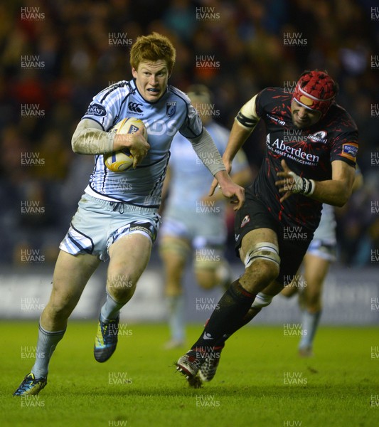 150213 Edinburgh v Blues - RaboDirect Pro12 - Blues' Rhys Patchell makes break to set up a try as Edinburgh's Izak van der Westhuizen chases 