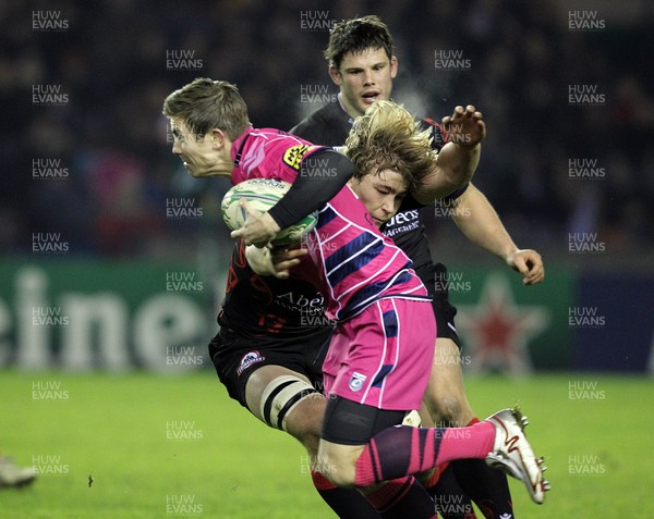 22.01.11 - Edinburgh v Cardiff Blues, Heineken Cup 2010/11 - Richard Mustoe is tackled by Edinburgh's David Denton 