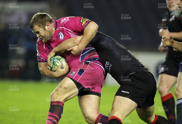 22.01.11 - Edinburgh v Cardiff Blues, Heineken Cup 2010/11 - Scott Andrews is tackled by the Edinburgh defence 