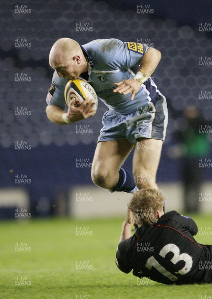 28.03.08 Edinburgh v Cardiff Blues... Blues'  Tom Shanklin runs over Edinburgh's Ben Cairns. 