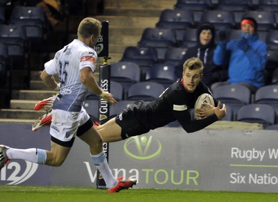 231114 - Edinburgh v Cardiff Blues - Guinness PRO12Edinburgh's Tom Brown dives in the corner to score a try  with Gareth Anscombe looking on(c) Huw Evans Picture Agency