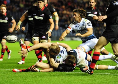 231114 - Edinburgh v Cardiff Blues - Guinness PRO12Cardiff's Macauley Cook spills the ball as he is tackled by Dougie Fife on the try line(c) Huw Evans Picture Agency