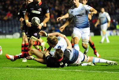 231114 - Edinburgh v Cardiff Blues - Guinness PRO12Cardiff's Macauley Cook spills the ball as he is tackled by Dougie Fife on the try line(c) Huw Evans Picture Agency