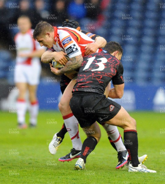 030513 - Edinburgh v Dragons - RaboDirect Pro 12 - Edinburgh centre Matt Scott attempts to stop a Dragons' drive by Ross Wardle 