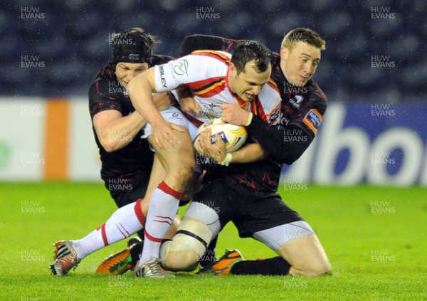 030513 - Edinburgh v Dragons - RaboDirect Pro 12 - Dragons' Dan Evans is brought down shy of the try line 