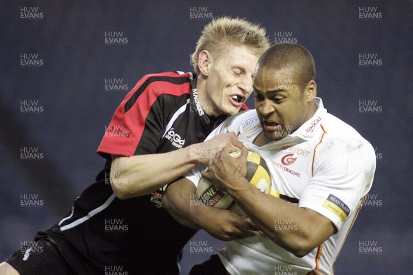 06/04/07: Edinburgh v Dragons in the Magners League; Nathan Brew of Dragons tackled by Ben Cairns of  Edinburgh. 