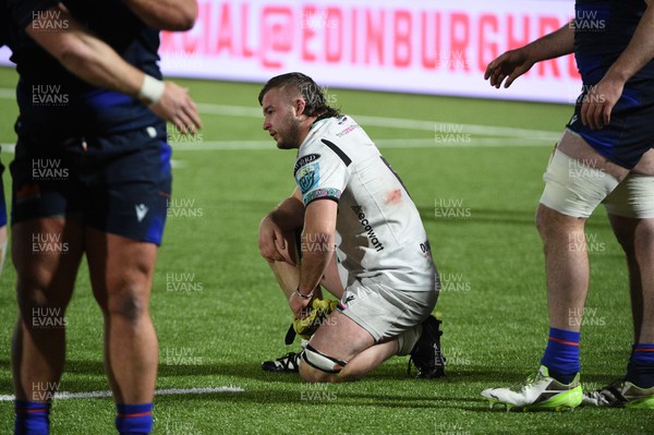 010324 - Edinburgh v Ospreys - United Rugby Championship - Harri Deaves of Ospreys slumps to his knees at the final whistle following a 19-15 defeat