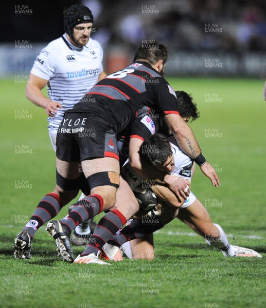 041117 - Edinburgh Rugby v Ospreys - Guinness PRO14 -  James Hook of Ospreys is tackled by opposite number Phil Burleigh and Cornell du Preez