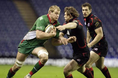 26.03.10 Edinburgh v Scarlets... Edinburgh's Ross Ford (R) tackles Scarlets's Damian Welch (L). 