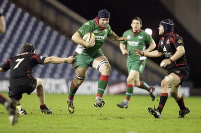 26.03.10 Edinburgh v Scarlets... Edinburgh's Ross Rennie (L) and Alan MacDonald tackle Scarlets's David Lyons. 