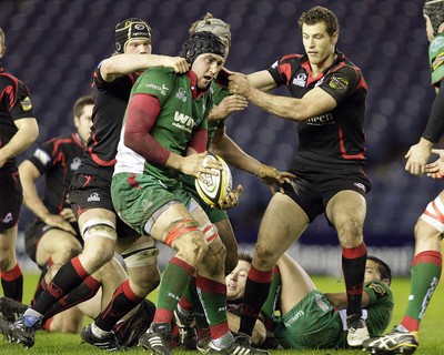 26.03.10 Edinburgh v Scarlets... Edinburgh's Scot Newlands (L) tackles Scarlets's Josh Turnbull. 