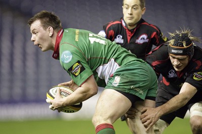 26.03.10 Edinburgh v Scarlets... Edinburgh's Scott MacLeod (R) tackles Scarlets's Matthew Rees (L). 