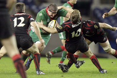 26.03.10 Edinburgh v Scarlets... Edinburgh's Phil Godman (R) tackles Scarlets's Rhys Thomas (c) . 