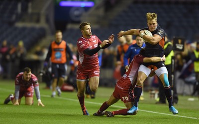 261019 - Edinburgh Rugby v Scarlets - Guinness PRO14 -  Eroni Sau of Edinburgh tackled by Dan Jones of Scarlets