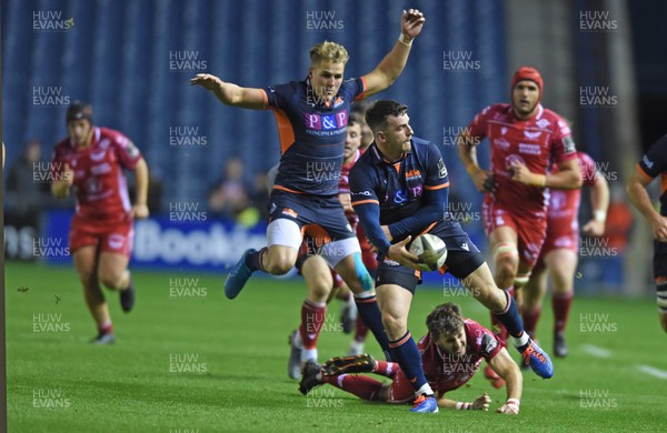 261019 - Edinburgh Rugby v Scarlets - Guinness PRO14 -  Dan Jones of Scarlets misses his tackle on Matt Scott of Edinburgh 