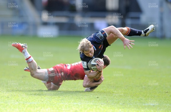 270221 - Edinburgh Rugby v Scarlets - Guinness PRO14 - Jaco van der Walt of Edinburgh takes a spectacular fall as he is caught by a classic ankle tackle by Scarlets scrum half Dane Blacker