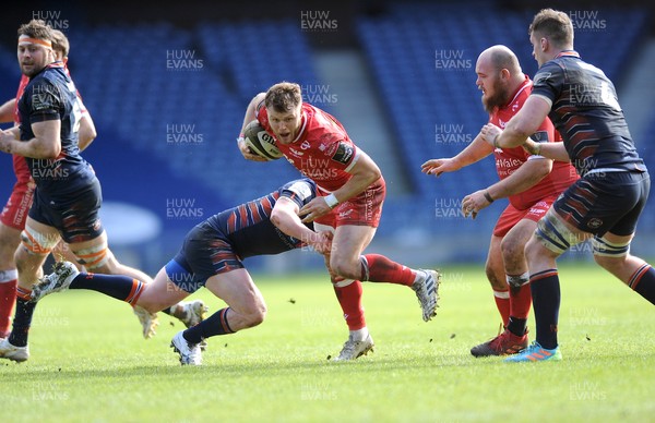 270221 - Edinburgh Rugby v Scarlets - Guinness PRO14 - Steff Hughes of Scarlets takes on opposite centre James Johnstone