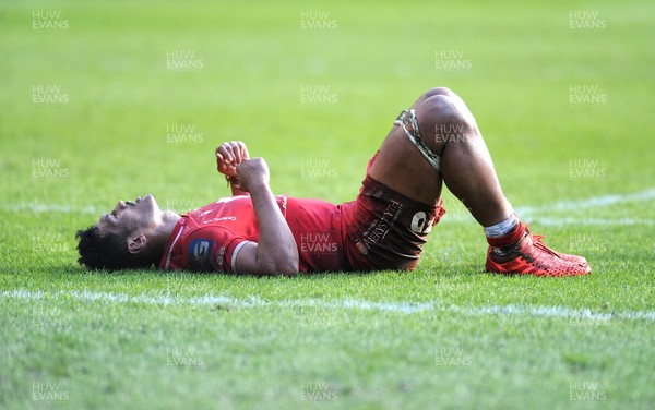 270221 - Edinburgh Rugby v Scarlets - Guinness PRO14 - Sam Lousi of Scarlets is exhausted at the final whistle