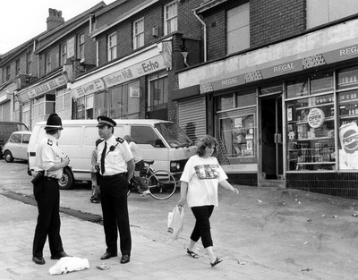 010991 - Picture shows police on the streets of Ely, Cardiff after the earlier riots in the area