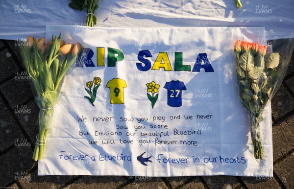 210120 - Tributes are laid and written to Emiliano Sala outside the Cardiff City Stadium on the first anniversary of the plane crash which claimed his life while travelling to Cardiff from Nantes Sala was due to meet up with new team mates after signing for Cardiff City from Nantes