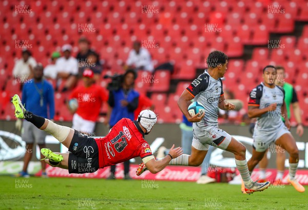 021223 - Emirates Lions v Dragons RFC - United Rugby Championship - Henco van Wyk tries to tackle Rio Dyer of Dragons