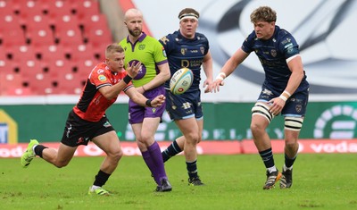 280326 - Fidelity SecureDrive Lions v Dragons RFC, United Rugby Championship - Ryan Woodman of Dragons RFC closes in on Nico Steyn of Lions