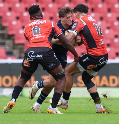 280326 - Fidelity SecureDrive Lions v Dragons RFC, United Rugby Championship - Sibabalwe Mahashe and Bronson Mills of Fidelity SecureDrive Lions tackle Huw Anderson of Dragons