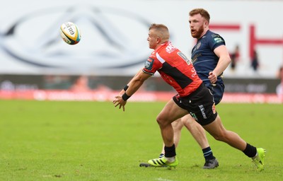 280326 - Fidelity SecureDrive Lions v Dragons RFC, United Rugby Championship - Aneurin Owen of Dragons RFC closes in on Nico Steyn of Lions