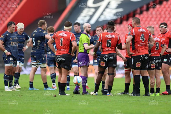 280326 - Fidelity SecureDrive Lions v Dragons RFC, United Rugby Championship - Referee Robbie Jenkinson speaks to the players