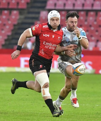 170525 - Emirates Lions v Ospreys - United Rugby Championship - Luke Morgan of Ospreys loses possession under pressure from Rynhardt Jonker of the Lions