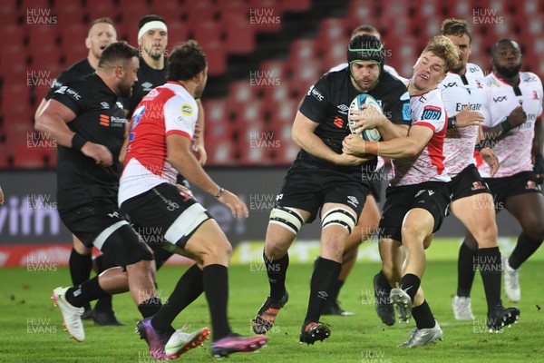 250322 - Emirates Lions v Ospreys - United Rugby Championship - Morgan Morris of the Ospreys tries to break a tackle