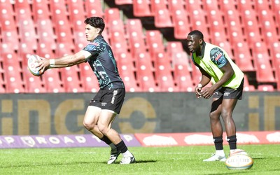110525 - Emirates Lions v Scarlets - United Rugby Championship - Teams warming up ahead of start