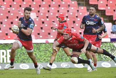 110525 - Emirates Lions v Scarlets - United Rugby Championship - Johnny Williams of Scarlets breaks through and score a try