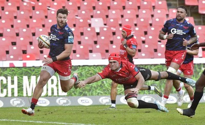 110525 - Emirates Lions v Scarlets - United Rugby Championship - Johnny Williams of Scarlets breaks through and score a try