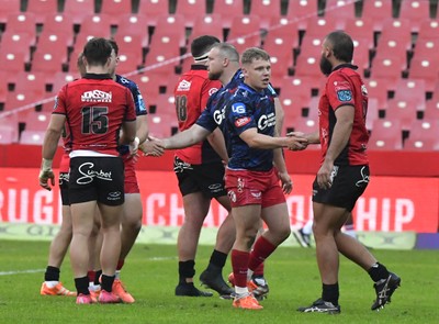 110525 - Emirates Lions v Scarlets - United Rugby Championship - Players shake hands at the end of the match