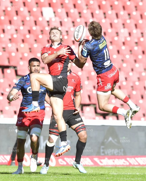 110525 - Emirates Lions v Scarlets - United Rugby Championship - Richard Kriel of the Lions fights for possession with Ellis Mee of Scarlets