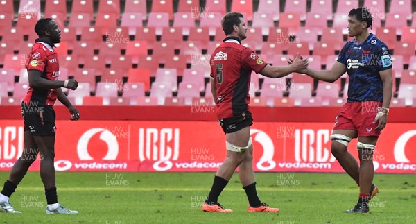110525 - Emirates Lions v Scarlets - United Rugby Championship - Players shake hands at the end of the match