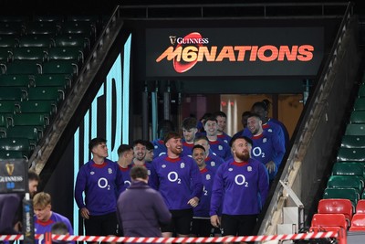 140325 - England Rugby Captains Run ahead of their final 6 Nations game against Wales Tomorrow - England players make their way out onto the pitch