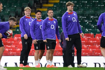 140325 - England Rugby Captains Run ahead of their final 6 Nations game against Wales Tomorrow - England players watch over their teammates during training