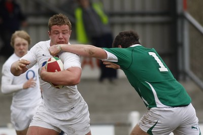 06.04.10 England U18 v Ireland U18 - Under 18s 5 Nations Festival -  England's Koree Britton brushes off the high tackle of Ireland's Rory Harrison. 