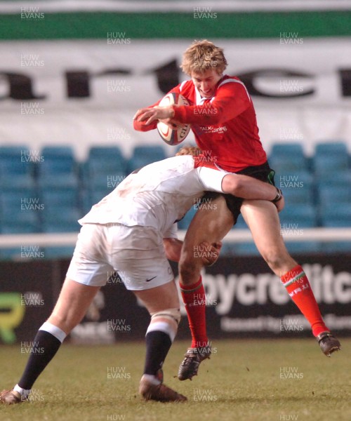 030206 - England U19 v Wales U19 -  Alec Jenkins of Wales gets airborne as Dan Cole tackles