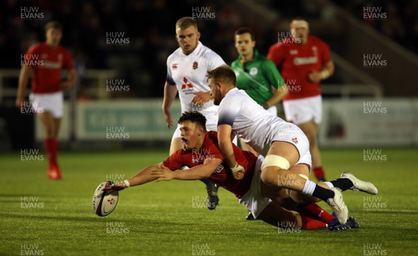 090218 - England U20 v Wales U20 - NatWest 6 Nations - Ryan Conbeer of Wales fumbles under the tackle of Sam Moore of England