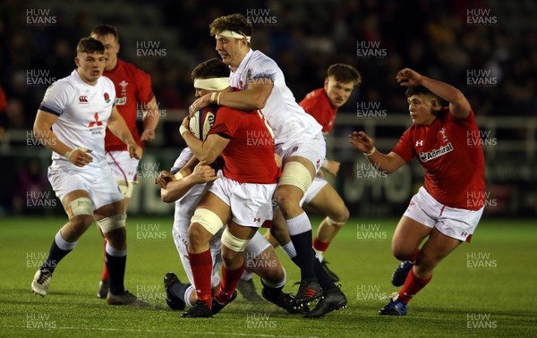 090218 - England U20 v Wales U20 - NatWest 6 Nations - Taine Basham of Wales is tackled by Dino Lamb of England